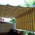 Toldo corredero con cortaviento