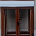 Ventanas en imitación madera de dos hojas practicables con monobloc