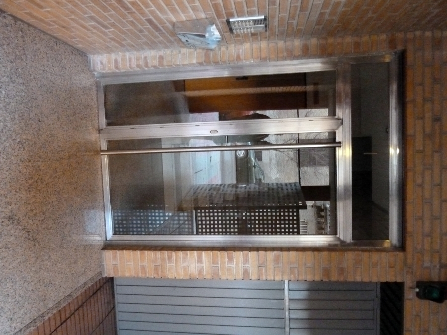 14- Puerta acceso portal acero inoxidable