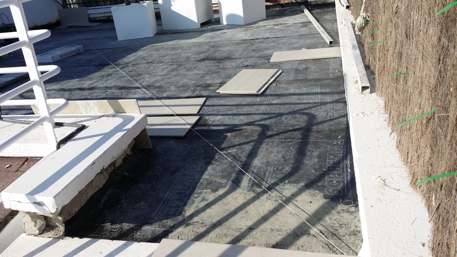 Colocación de tela asfáltica en terrado