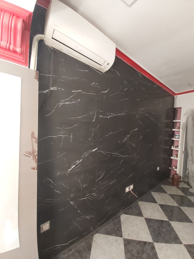 Alicatado de 100 cm x 30 cm en pared salon.