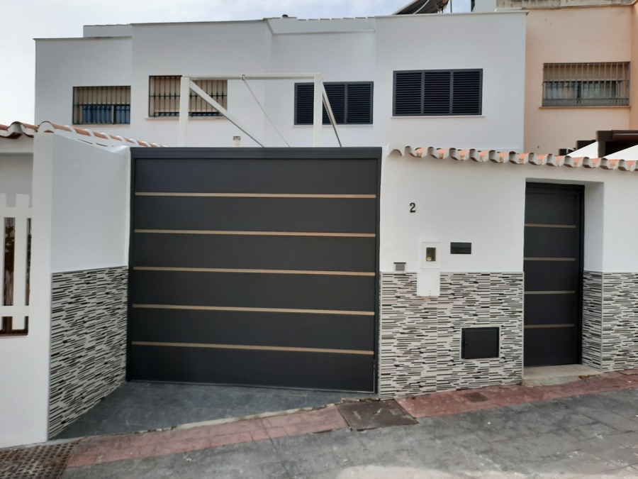 Pintado a pistola de portones en color forja negro