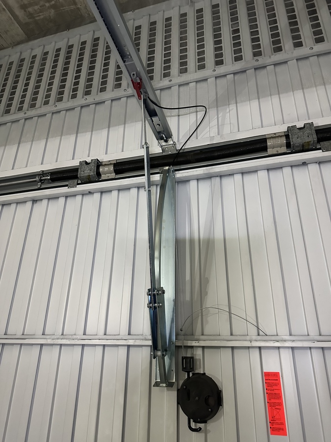 Sistema desbloqueo para puerta motorizada