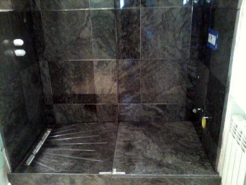 Aplacado y plato de ducha en granito