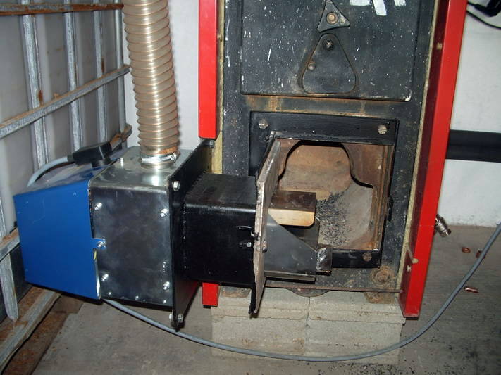 caldera de leña y carbon transformada a biomasa