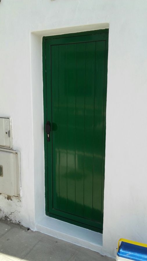 Sustitucion puerta madera por aluminio