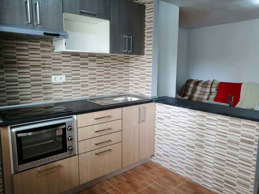 Cocina con barra americana.