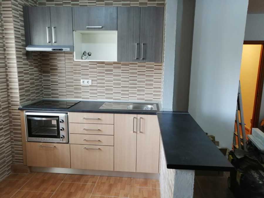 Cocina con barra americana.