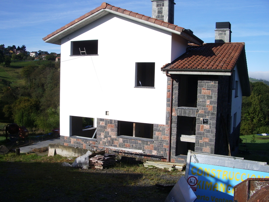 Acabado de fachada de aislone  y piedra