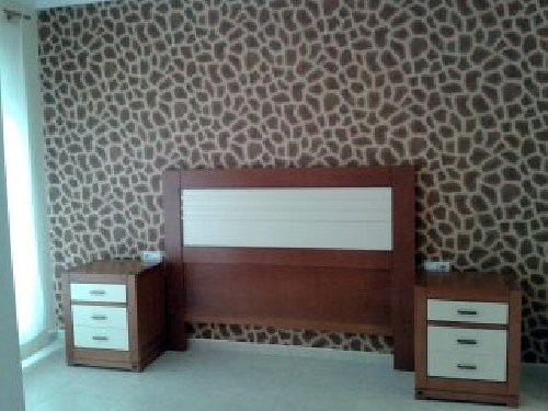 papel pintado africa en cabecera dormitorio