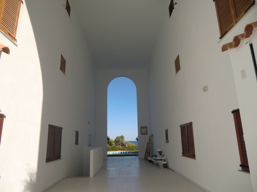 Pintando la fachada con un revestimiento de MONTO con garantia de 5AÑOS