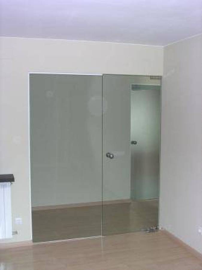 puerta de vidrio vaivén con fijo lateral