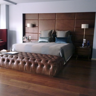 Cabezal de piel y puf de capitoné