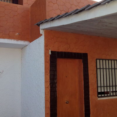 Construcción de terraza y revestimiento fachada