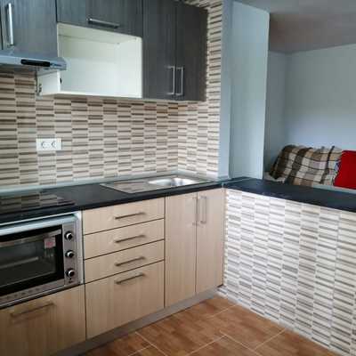 Cocina con barra americana.