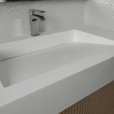 Lavabo inclinado con tapa registrable