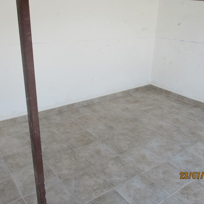 RETIRADA VOLADIZO DETERIORADO Y ENLOSADO DE TERRAZA