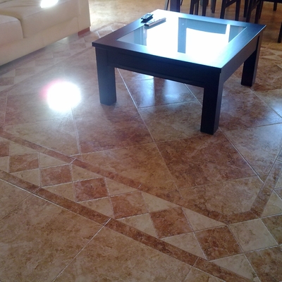 Suelo salón con cenefa realizada artesanal