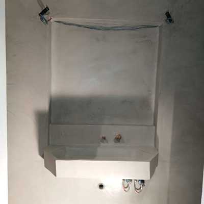 restauración de masia. lavabo revestido en microcemento