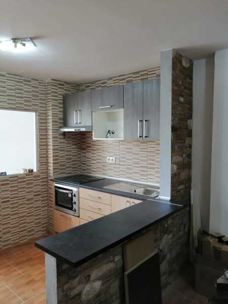 Cocina con barra americana.