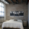 Dormitorio con pared de ladrillo