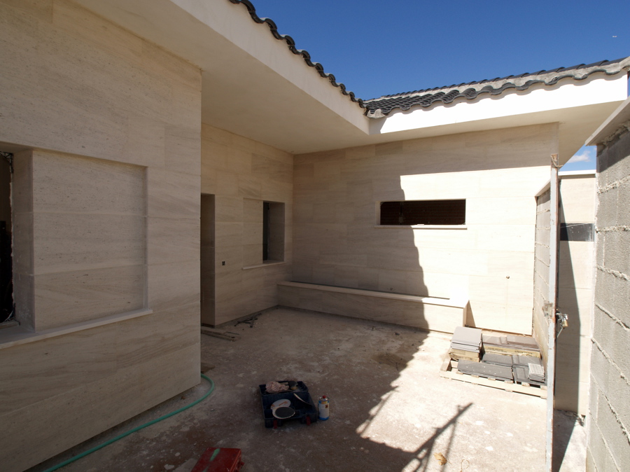 Aplacado de Piedra pegada con mortero cola