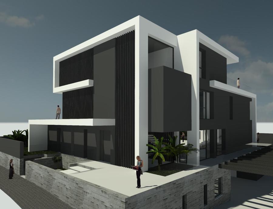 Fachadas de la entrada que intercala ventanales y volúmenes en hormigón