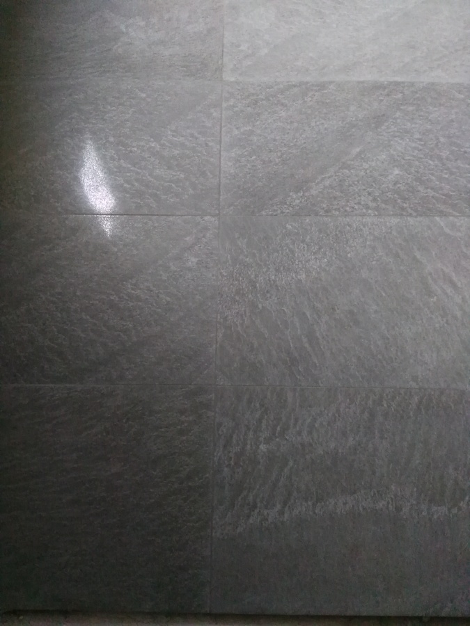 Colocación de pavimento rectificado pulido grafito.