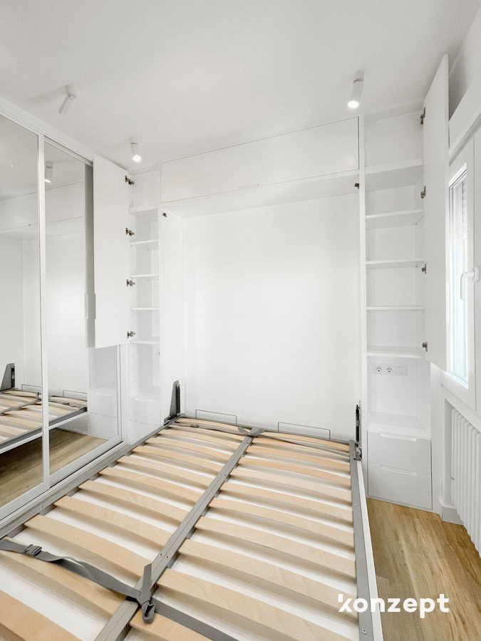 dormitorio cama abatible y armario cabecero