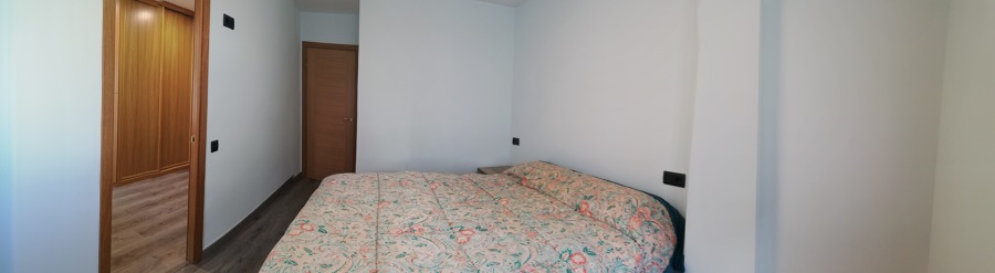 Dormitorio con vestidor