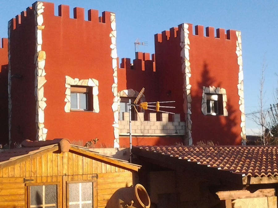 fachada piedra y monocapa