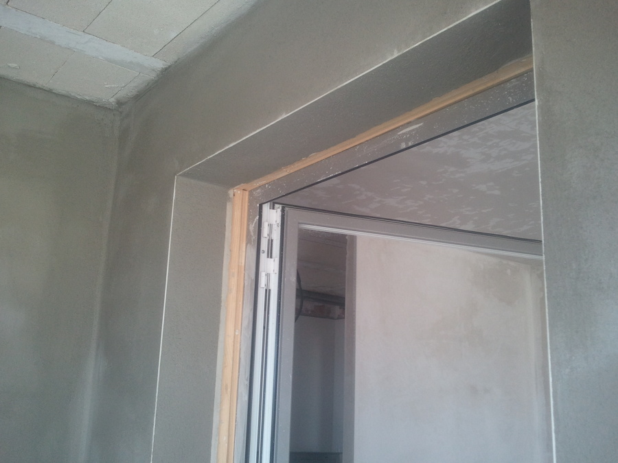 Montaje carpintería aluminio y lucido de paredes terraza