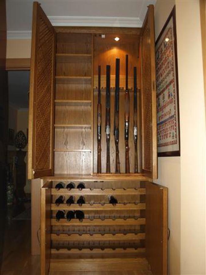 Mueble de entrada botellero y armero en Roble.