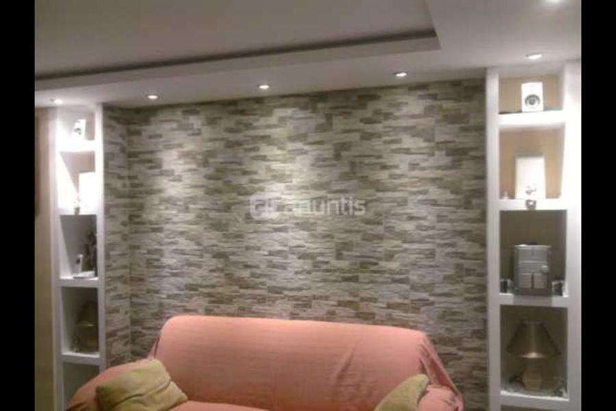 Mueble escayola con luces y forrado de pavimentoi piedra