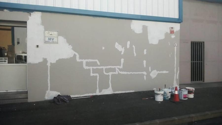 pintura exterior de nave industrial reparación de superficies