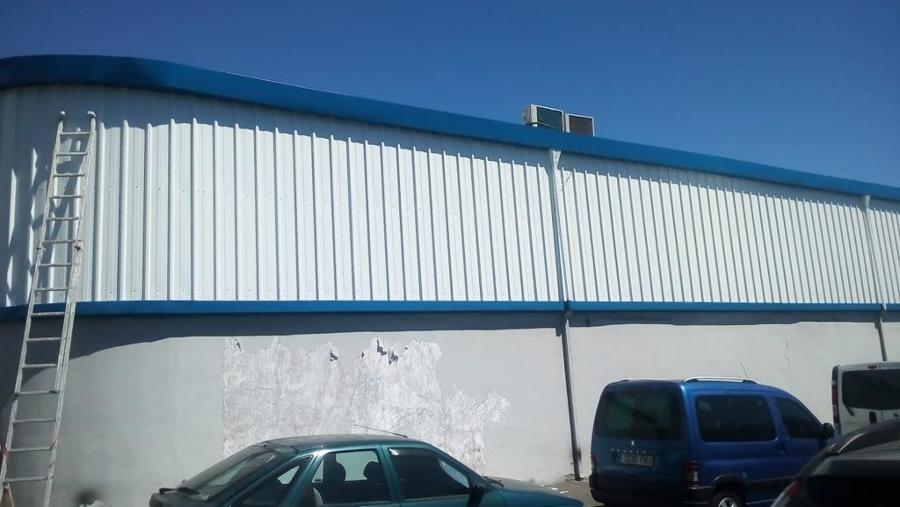 pintura exterior de nave industrial reparación de superficies