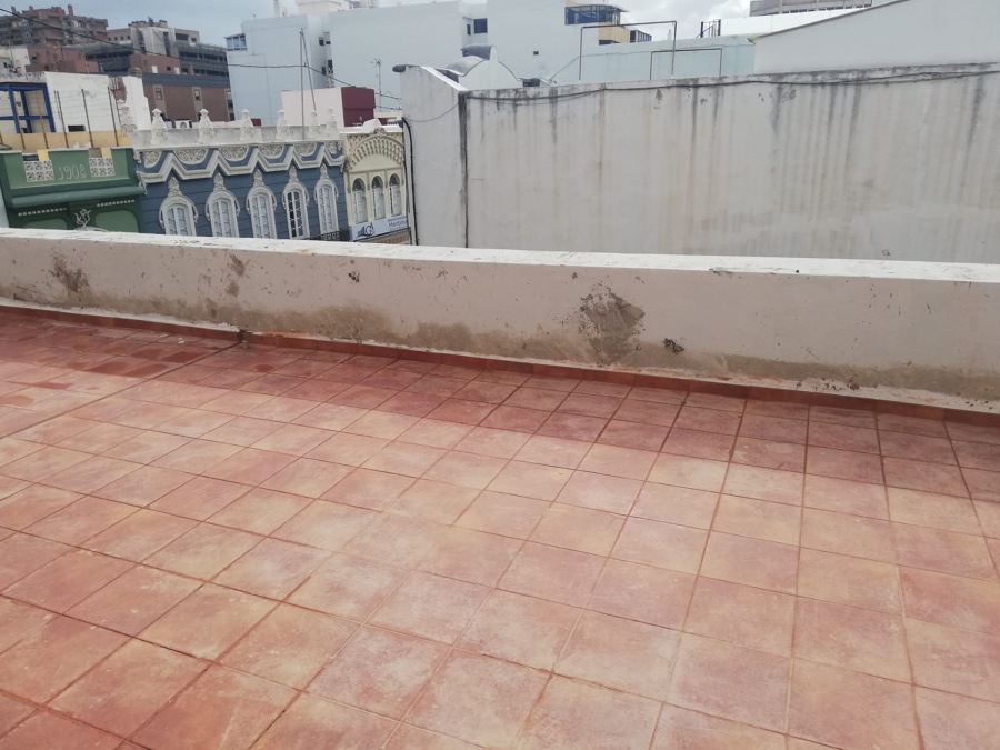 Pintura y reparación de muros en pretiles edificio