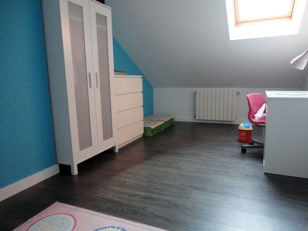 Buhardilla reformada estando en bruto