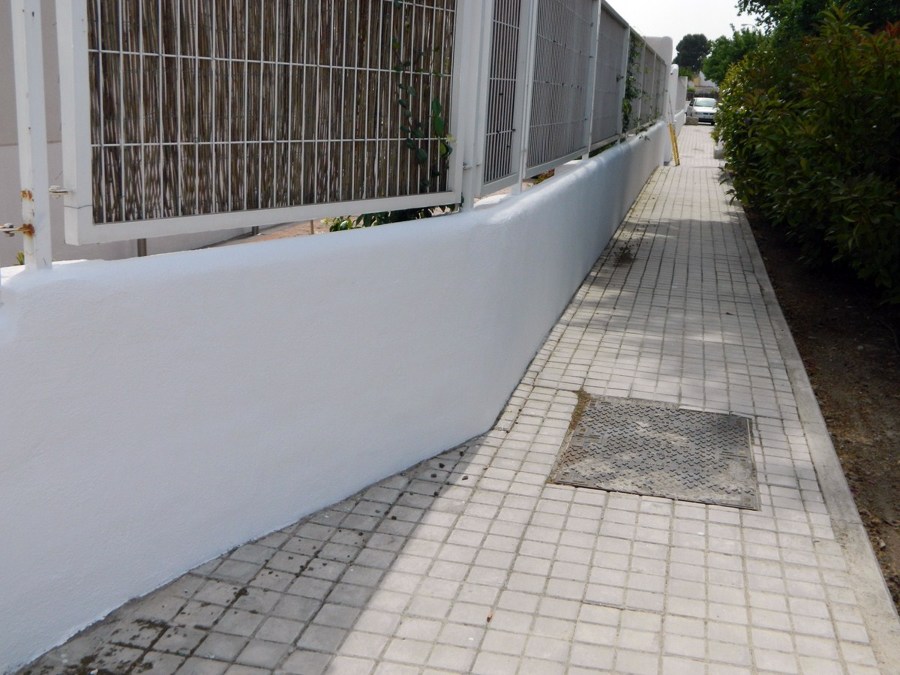 valla exterior comunidad despues de aplicacion revestimiento