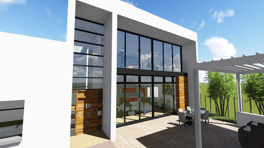 vista de la cristalera a doble altura del salón y de la puerta de entrada