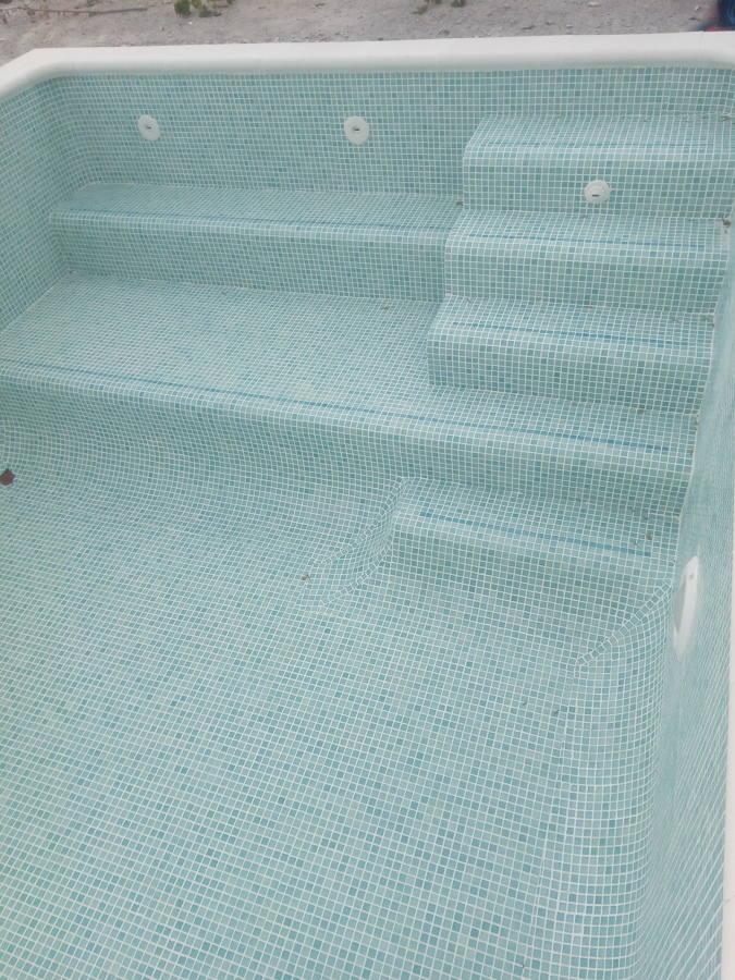 Zona de entrada con gresite Reviglass PS-40.