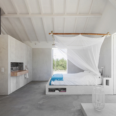 Habitación con blancos, grises y cemento