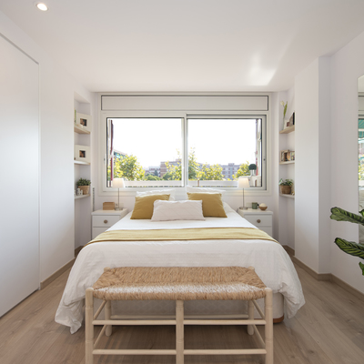 Dormitorio con la ventana de cabecero