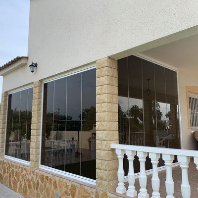 Cerramiento cristal bronce C/Hornos
