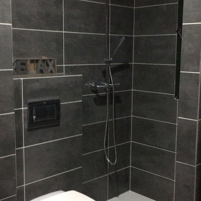 Zona de ducha y vasija