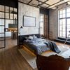 Dormitorio de estilo industrial con grandes techos