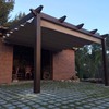 Pérgola de madera con toldo corredero
