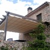 Pérgola de madera con toldo corredero