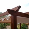 Pérgola de madera con toldo corredero