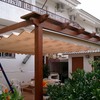 Pérgola de madera con toldo corredero